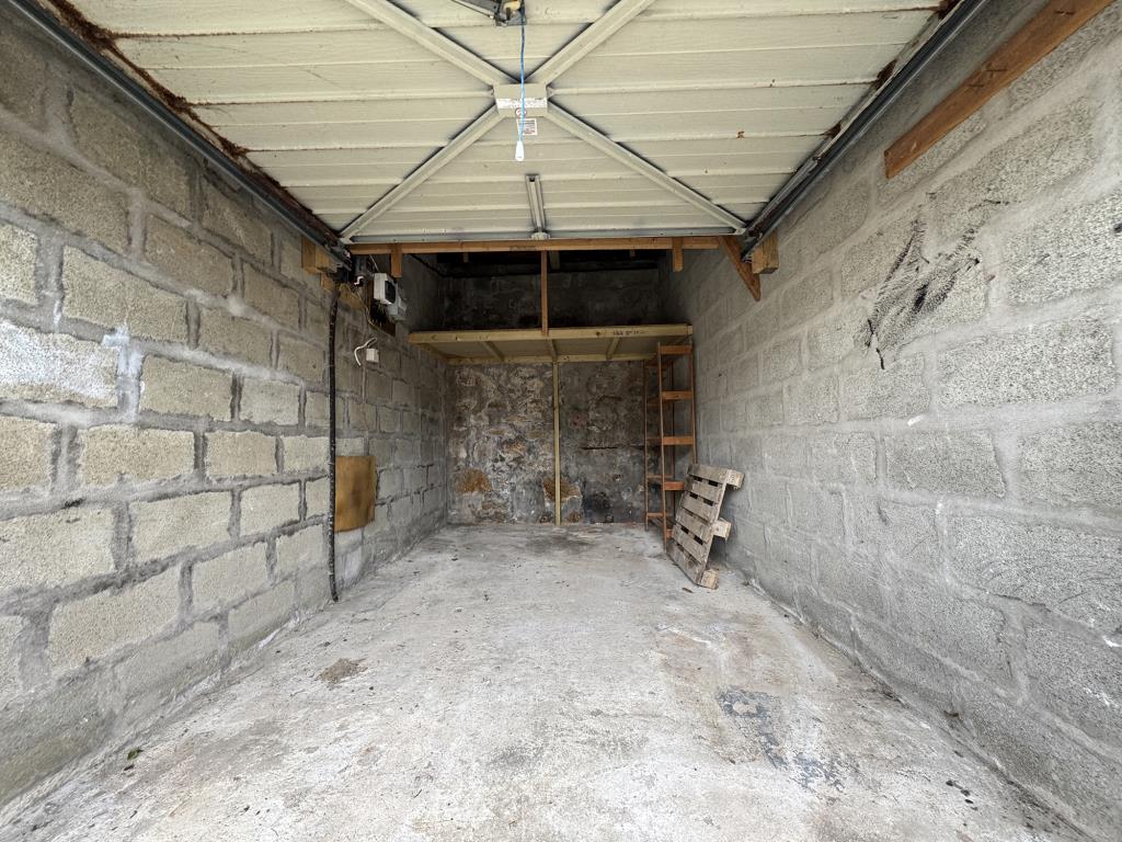 Lot: 16 - BLOCK OF GARAGES INCLUDING LARGE WORKSHOP - Garage with lighting (one of four)